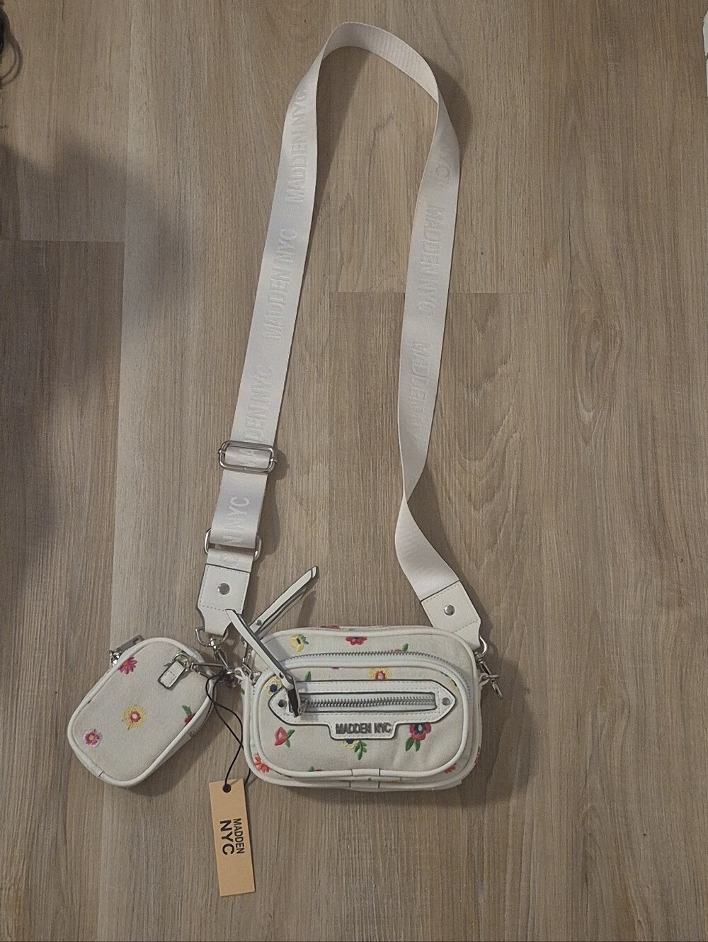 Madden NYC floral embroidered camera crossbody bag features a detachable Bag